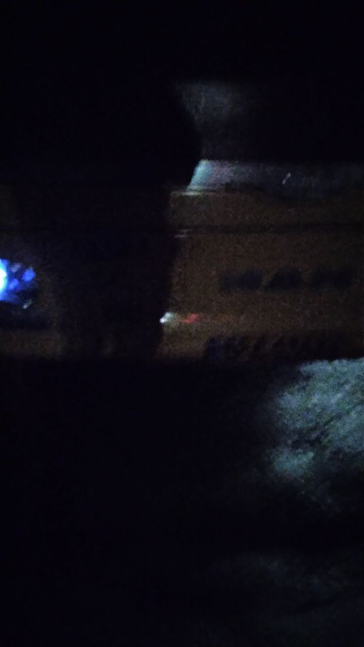 A truck passing on the dark road